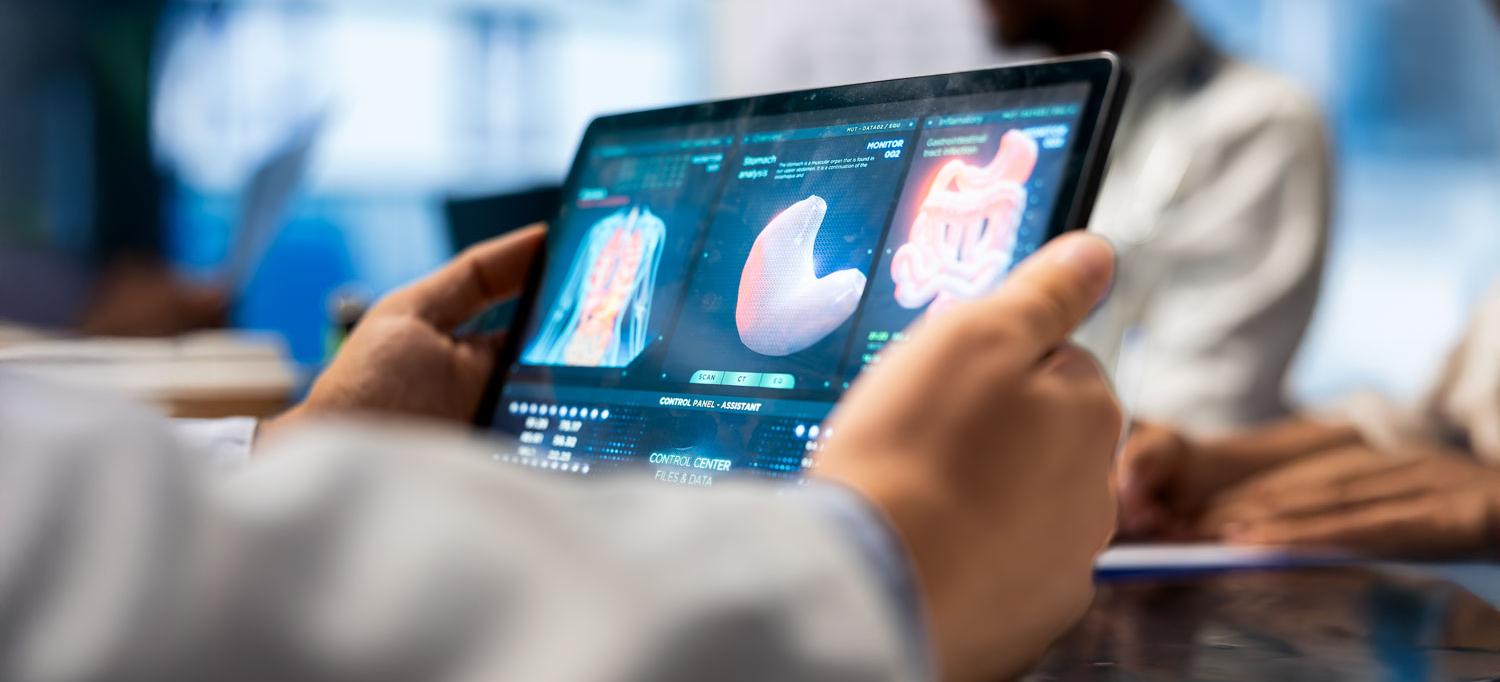 Doctor looking at MRI brain scan data on a tablet 