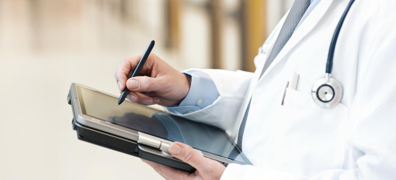A doctor using a tablet