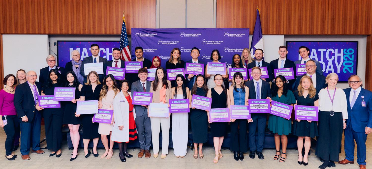 Soon-to-be graduates celebrate their residency matches with faculty members and the dean.