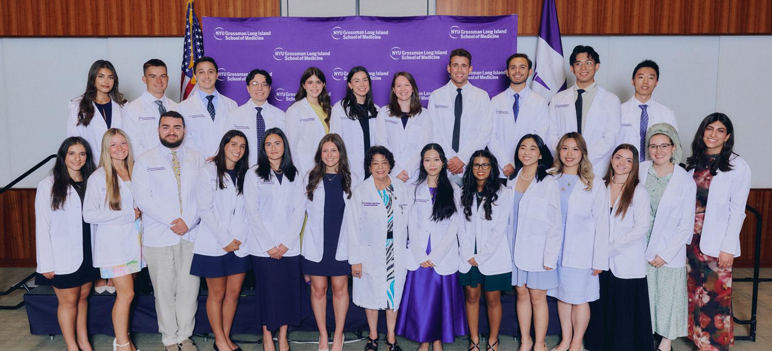 Dr. Gladys M. Ayala with incoming students at the White Coat Ceremony.