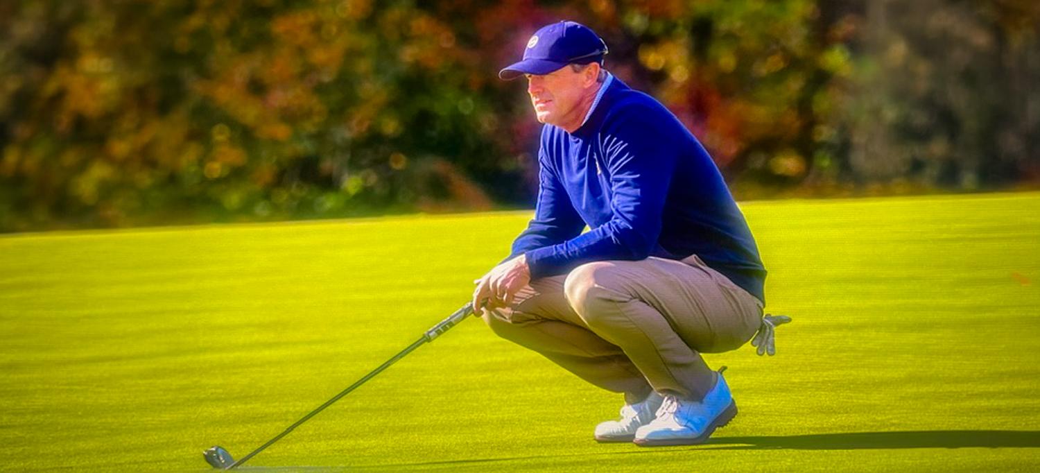 Pro golfer Scott Ford holds his gaze green after completing a powerful swing.