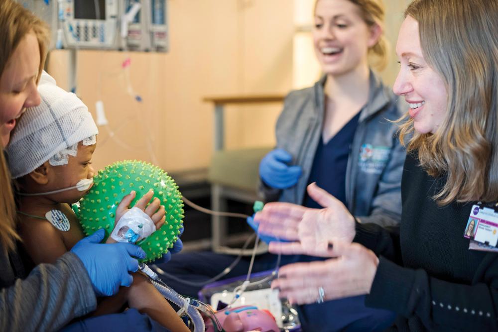 Jodi Herbsman with a Patient in the PICU