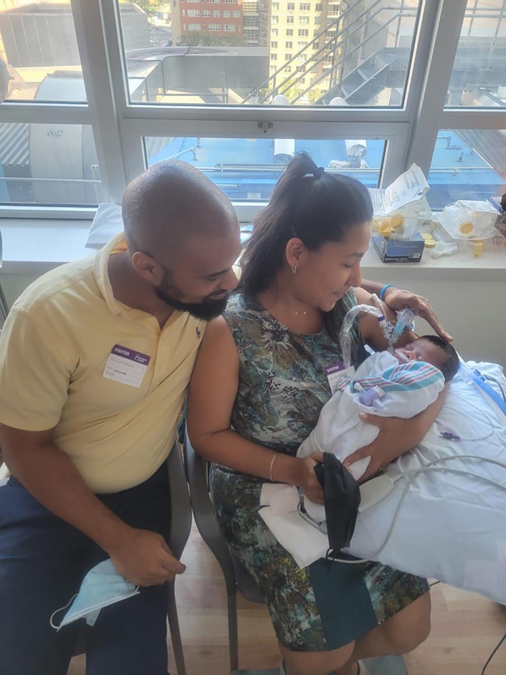 Yadi Martin Holds 1-Month-Old Aydin as His Father Jamaal Looks On