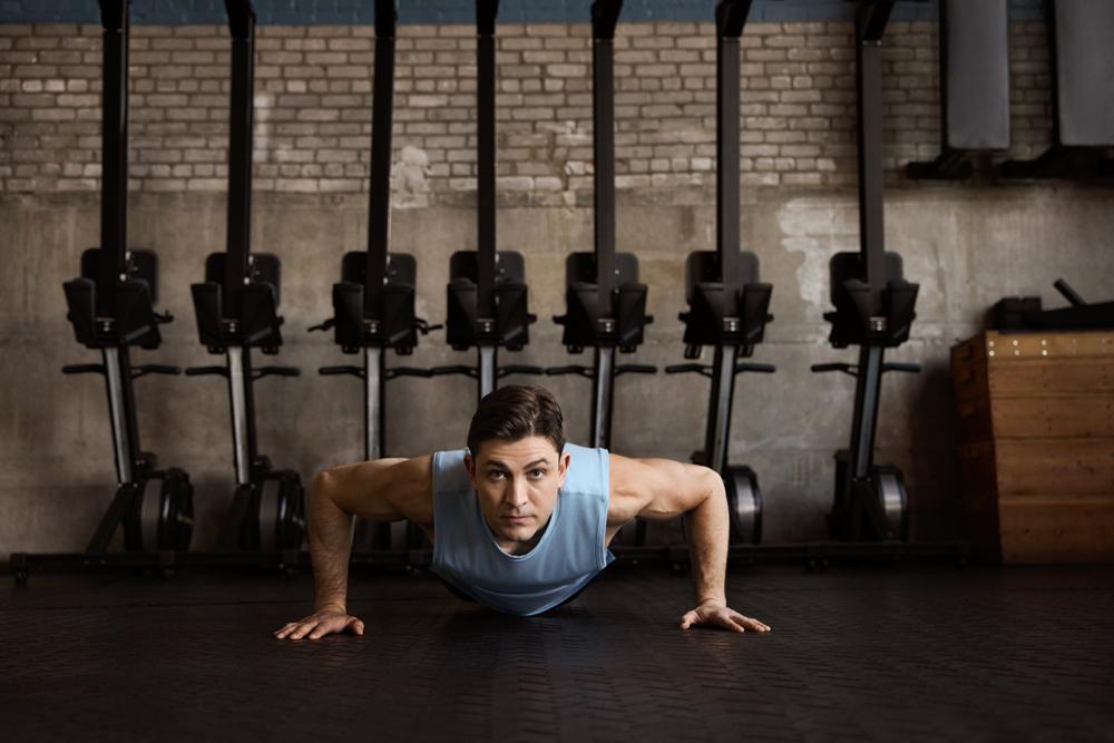 Dr. Jacques H. Hacquebord holds a push-up pose at the gym.