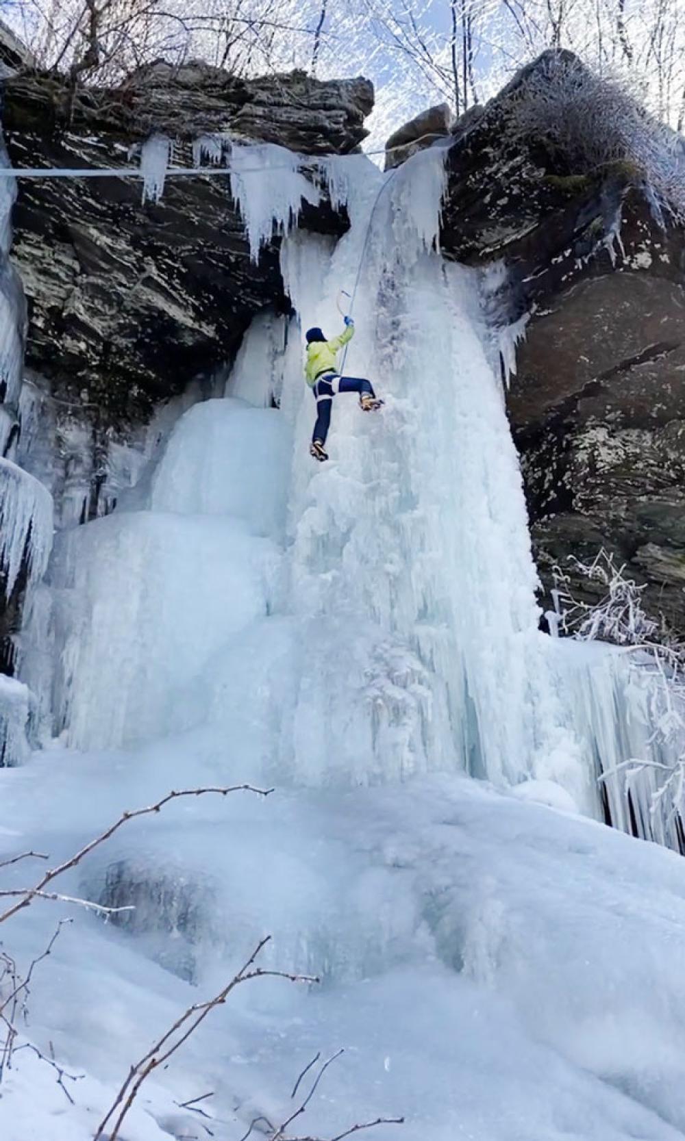 Wawrzyniak climbs a frozen waterfall.