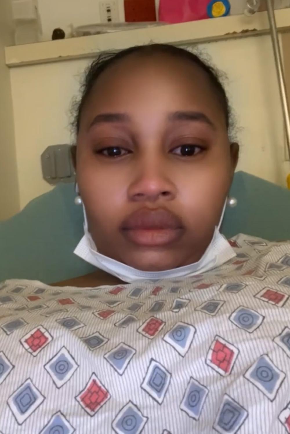 Diallo in a hospital gown