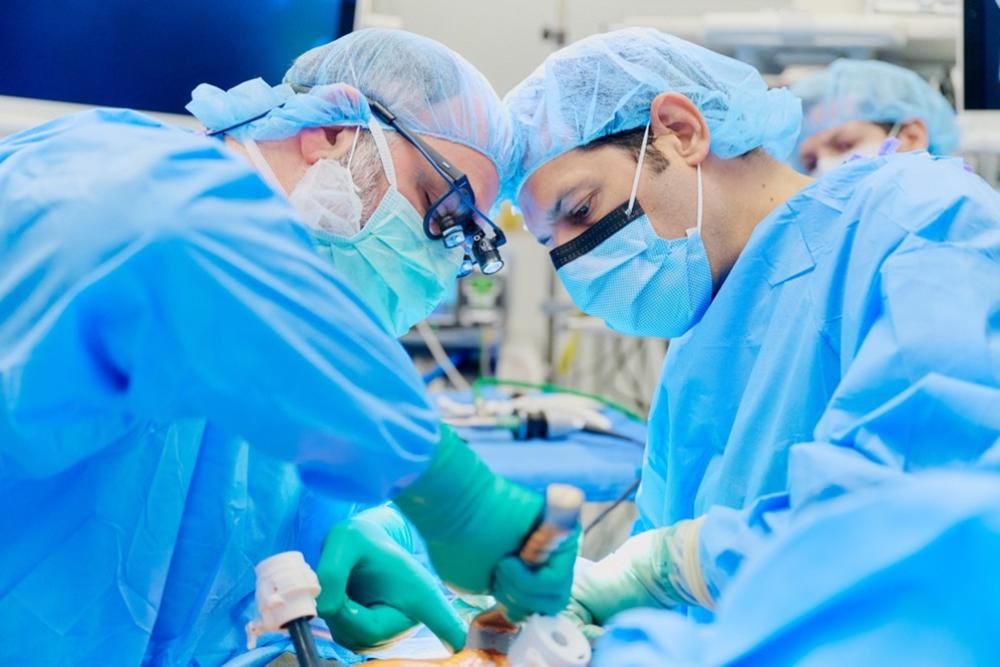Drs. Jonathan C. Berger and Bruce E. Gelb in the operating room