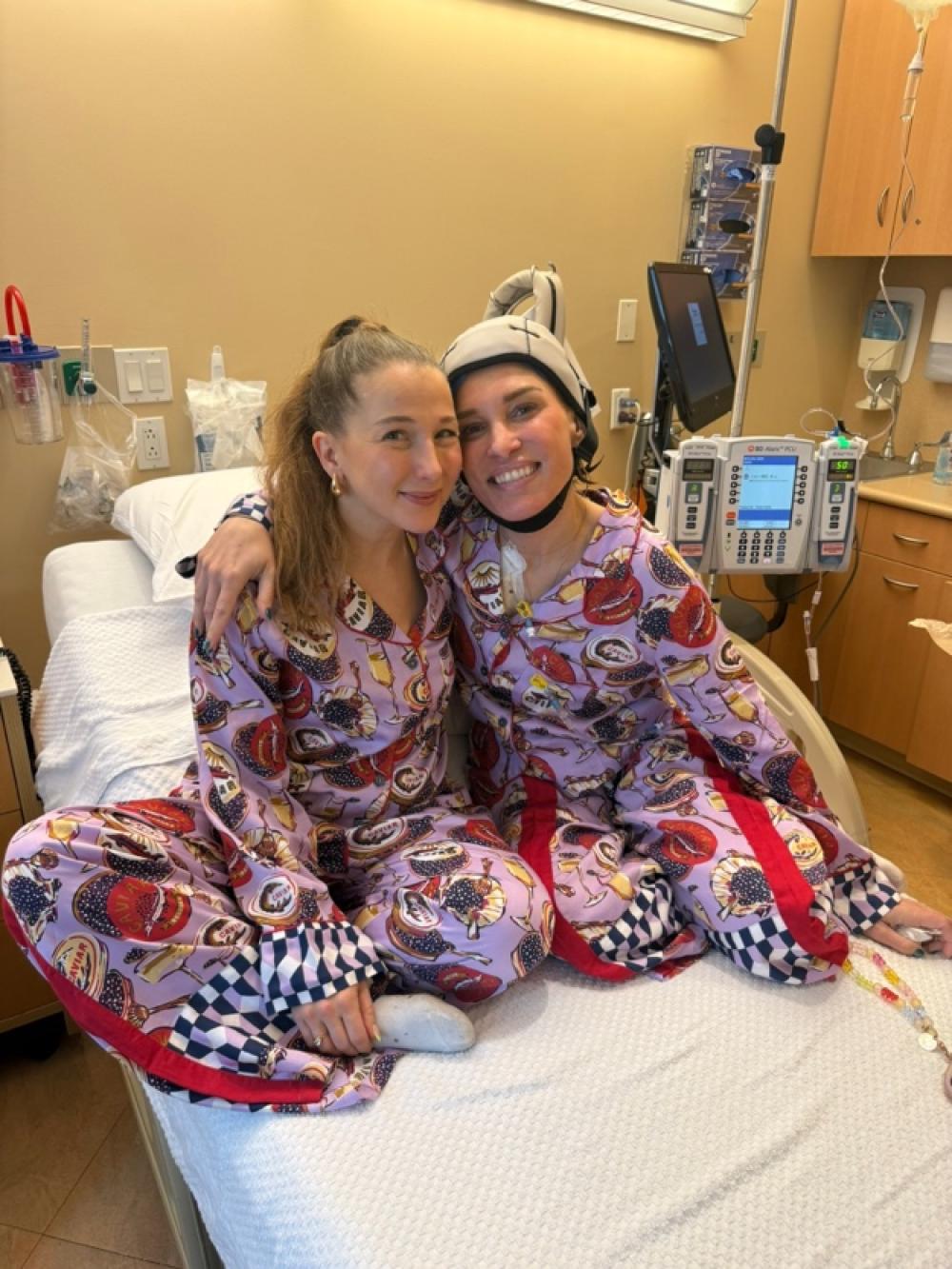 Jennifer Taylor and Adrien Finkel wear matching pajamas at Perlmutter Cancer Center.
