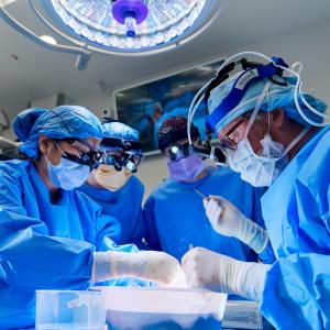 Surgeons and other working in an operating room