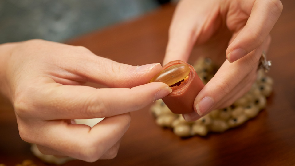 Hands Holding a Vitamin