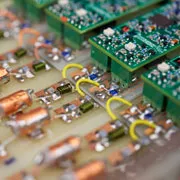 A detailed view of a circuit board with wires and components.